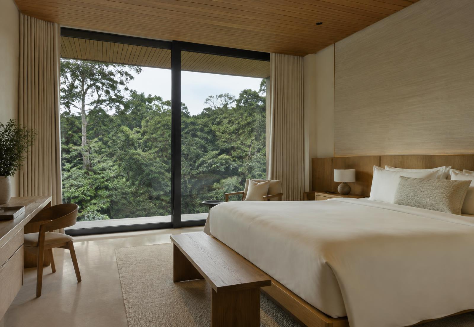 Forest view room with large window overlooking green canopy